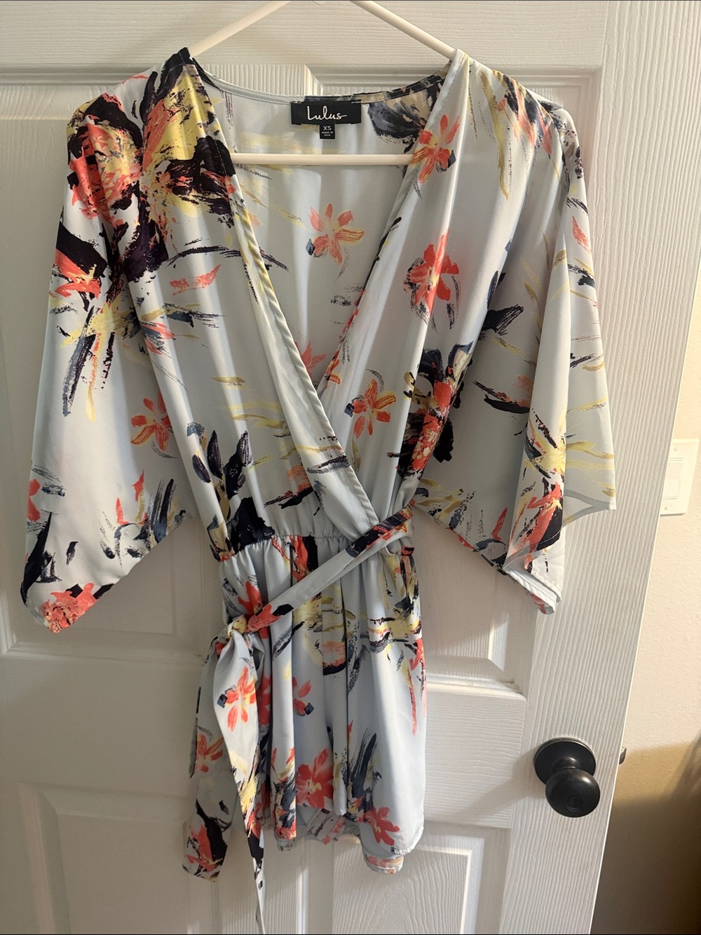 Lulu's Light Blue Floral Wrap Romper with Coral & Navy Accents